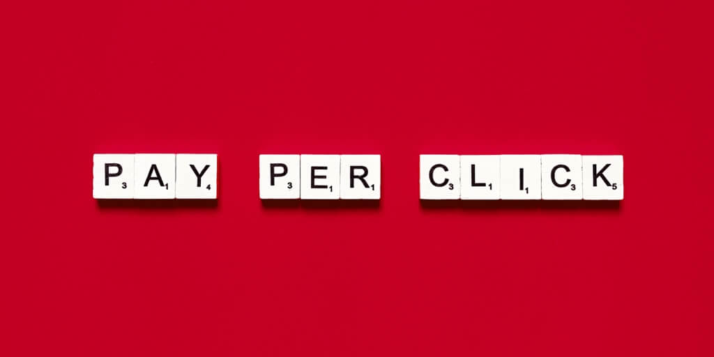 Words Pay per click against the monochrome red background.