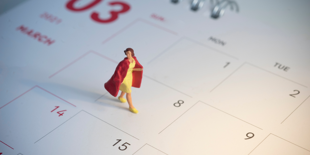 A miniature figure of a woman on a calendar.