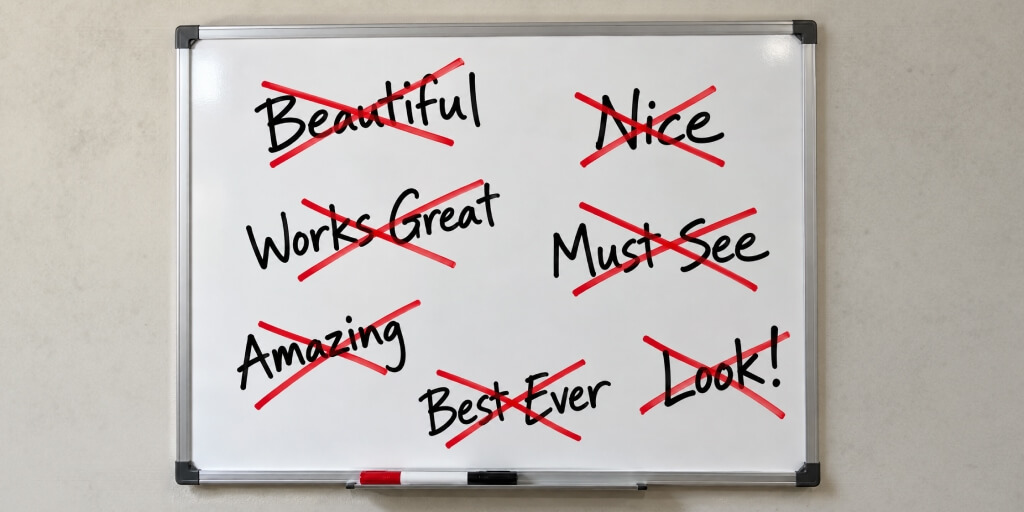 A whiteboard with words Beautiful, Nice, Best Ever written on it with a black marker. Each word is crosses-out with a red marker.